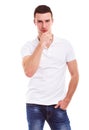 Pensive man in a white polo shirt Royalty Free Stock Photo