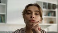 Pensive millennial girl looking webcam closeup. Thinking woman watching webinar Royalty Free Stock Photo