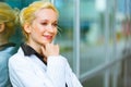 Pensive modern business woman near office building Royalty Free Stock Photo