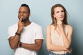 Pensive multiethnic man and woman thinking over dilemma