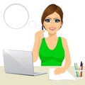 Pensive office secretary woman working at the laptop Royalty Free Stock Photo