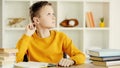 pensive preteen boy thinking while doing Royalty Free Stock Photo