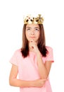 Pensive preteen girl with a crown