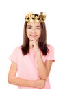 Pensive preteen girl with a crown