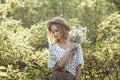 Pensive pretty girl in a straw hat