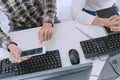 Pensive programmer working on desktop pc programming code technologies or website design at office Software Development Company Royalty Free Stock Photo