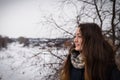 Pensive and romantic girl on the winter background