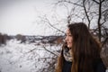 Pensive and romantic girl on the winter background