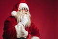 Pensive santa claus touching beard and chin Royalty Free Stock Photo