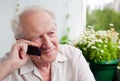 Pensive Senior Man With a Phone Royalty Free Stock Photo