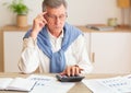 Pensive Senior Man Using Calculator Sitting In Modern Office Royalty Free Stock Photo