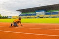 Pensive sporty man getting focused and ready for running training. Afro American runner athlete standing on start line Royalty Free Stock Photo