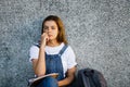 Pensive student girl sitting on the floor Royalty Free Stock Photo