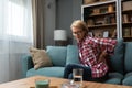 Pensive thoughtful middle aged lady looking away sit alone at home feel anxious lonely, sad depressed melancholic old mature woman Royalty Free Stock Photo