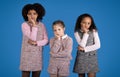 Pensive tired sad international little girls in casual looking at camera, thinking Royalty Free Stock Photo