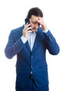 Pensive and upset businessman keeps hand to head looking stressed and bewildered isolated on white background. Businessman