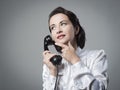Pensive vintage secretary on the phone