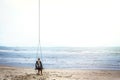 Pensive woman on the beach looking into the distance Royalty Free Stock Photo