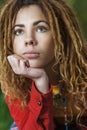 Pensive woman with dreadlocks closeup Royalty Free Stock Photo