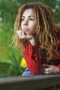 Pensive woman with dreadlocks closeup