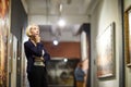 Pensive Woman in Museum Royalty Free Stock Photo