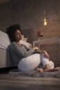 Pensive woman sitting by the bed Royalty Free Stock Photo