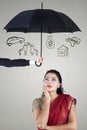 Pensive woman under umbrella