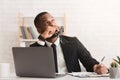 Pensive young businessman working on new business plan in office Royalty Free Stock Photo