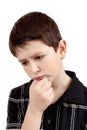Pensive young boy isolated on white background Royalty Free Stock Photo