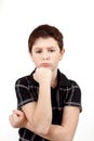 Pensive young boy isolated on white background Royalty Free Stock Photo