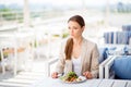 Pensive young business lady is having her lunch at the roof top Royalty Free Stock Photo