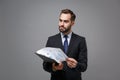 Pensive young business man in suit shirt tie posing isolated on grey background. Achievement career wealth business Royalty Free Stock Photo