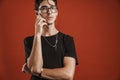 Pensive young hipster teenager in glasses isolated