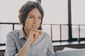 Pensive young hispanic business woman looking at laptop screen, using modern technology at work Royalty Free Stock Photo