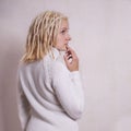 Pensive young woman with blonde dreadlocks Royalty Free Stock Photo