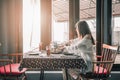 Pensive young woman dinner alone in the room Royalty Free Stock Photo