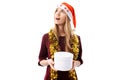 Pensive young woman, wearing a Santa Claus hat, dreams, looking Royalty Free Stock Photo