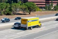 Penske rental truck is driving on a multilane highway. Elevated view. - San Jose, California, USA - 2020 Royalty Free Stock Photo