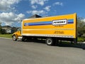 A Penske Rental truck used to move a family to a new home.  Penske Truck Rental is a privately held company owned by Penske Royalty Free Stock Photo
