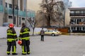 Penticton, BC, Canada - March 7, 2022: Firefighter and onlookers checking the area behind the historic Warren House as it burns