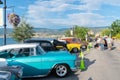 People looks at classic cars at car show in Penticton