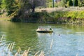 People swimming and floating in inner tube down the Penticton River Channel in summer Royalty Free Stock Photo