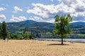 PENTICTON, CANADA - JULY 05, 2020: Sudbury Beach and Skaha Lake British Columbia with white clounds on sky