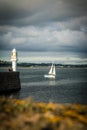 Penzance Lighthouse and sailboat Royalty Free Stock Photo