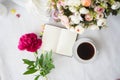 Peony bunch, cup of coffee, keyboard, notepad, wafers and pan, romance concept