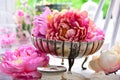 Peony flowers in antique silver bowl