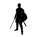 Silhouette of a male fighter with battle armor and sword weapon. Royalty Free Stock Photo