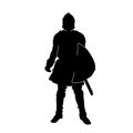 Silhouette of a male fighter with battle armor and sword weapon. Royalty Free Stock Photo