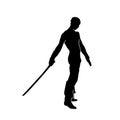 Silhouette of a male warrior holding a sword blade weapon. Royalty Free Stock Photo