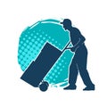 Silhouette of a male worker pushing lori wheels transporting carboard boxes. Royalty Free Stock Photo